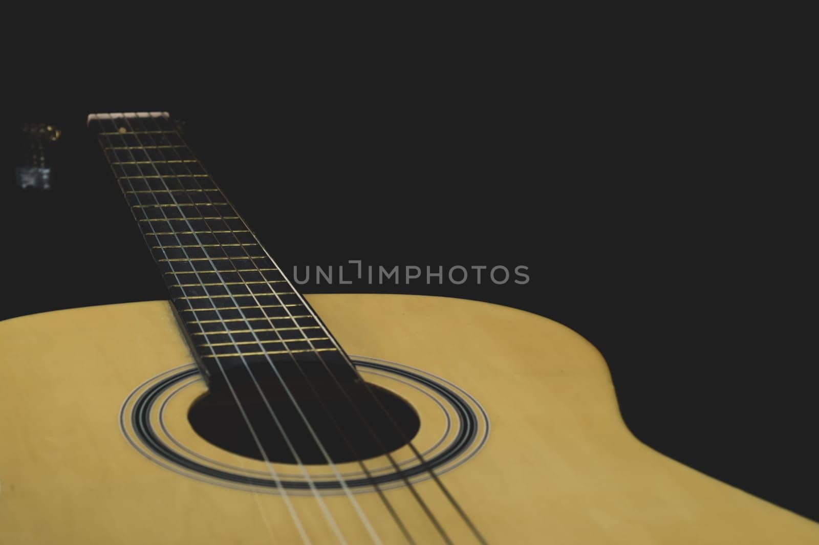 Acoustic guitar close up. musical instrument. strings on the guitar fretboard