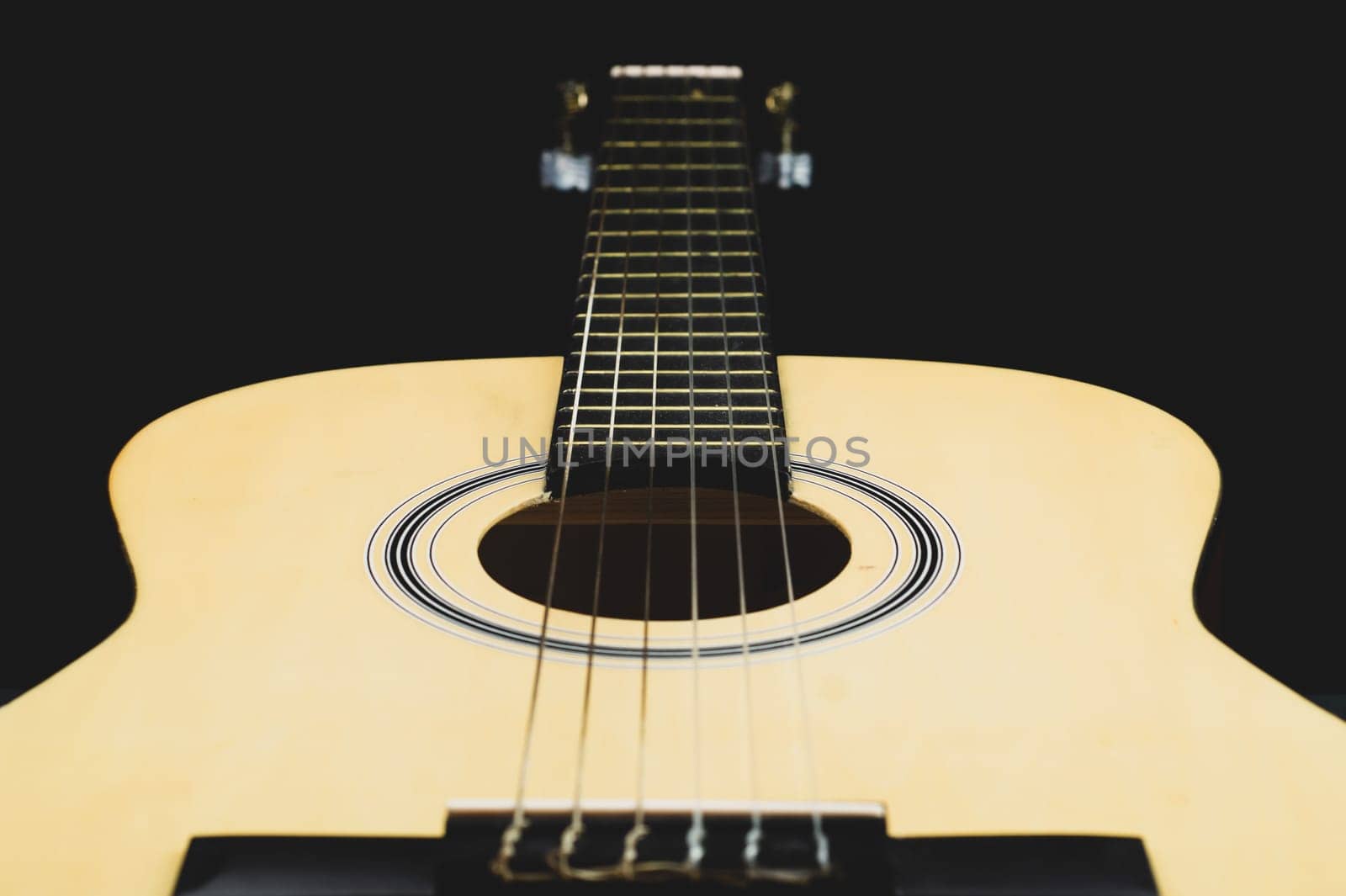 Acoustic guitar close up. musical instrument. strings on the guitar fretboard