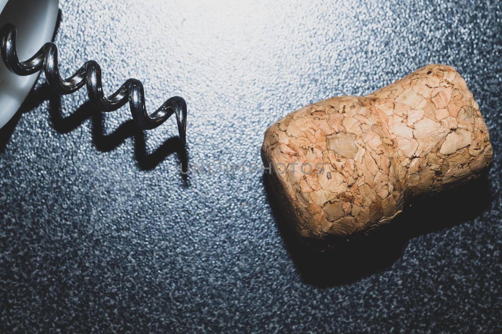 Wine cork and corkscrew on the table close up