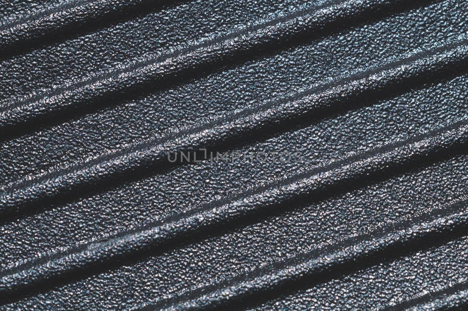 Black plastic texture. ribbed background