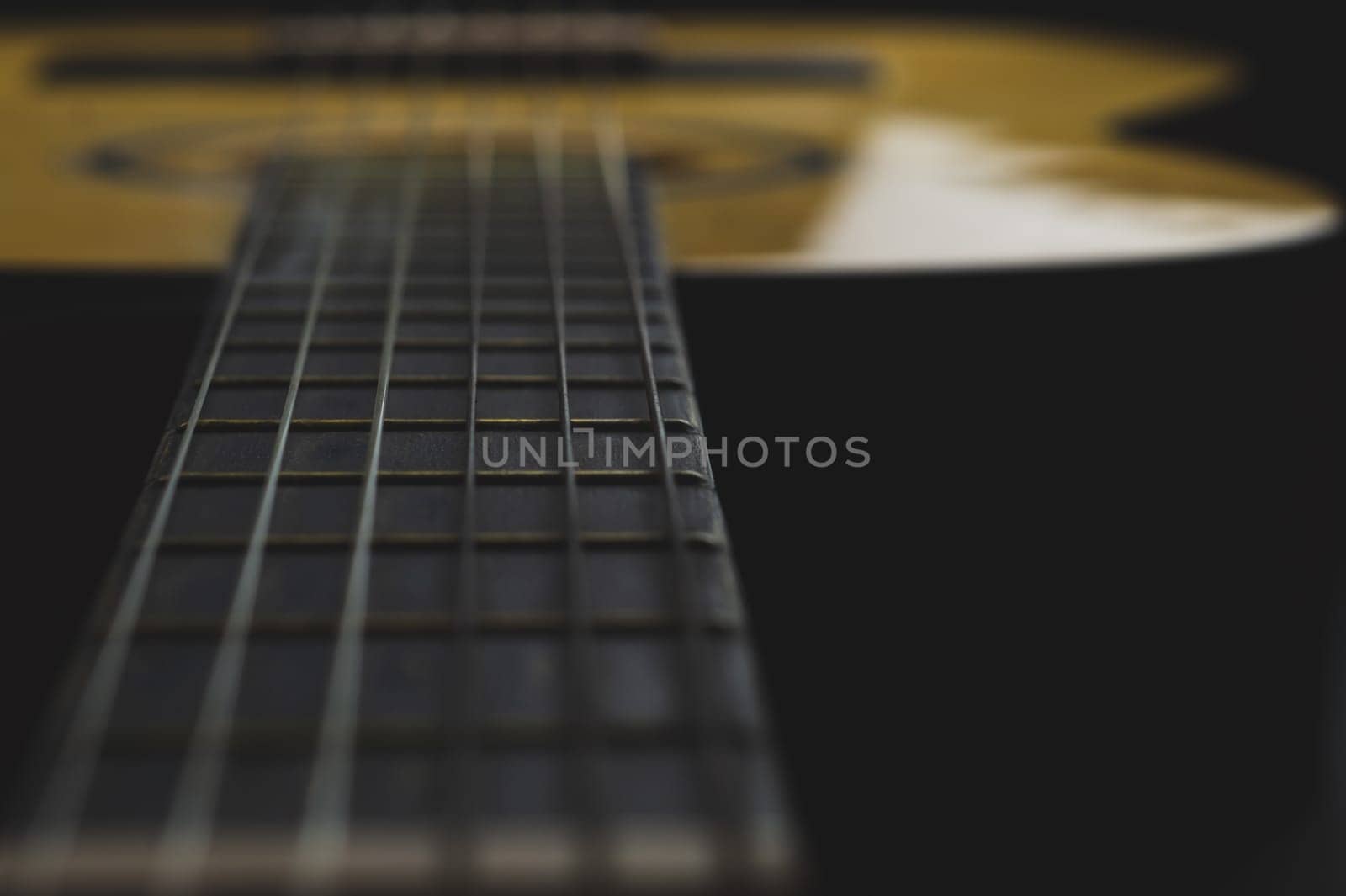 Acoustic guitar close up. musical instrument. strings on the guitar fretboard