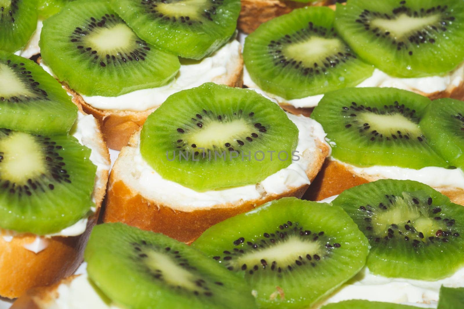 Sandwiches with kiwi. bread with fruit slices. background with appetizer