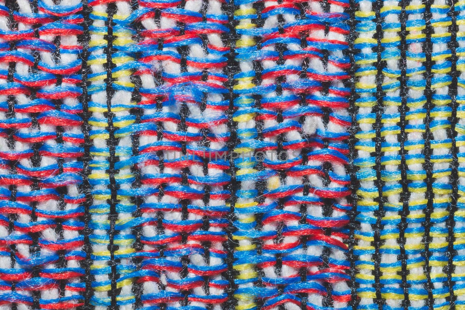 Colorful knitted wool background. woolen fibers close up