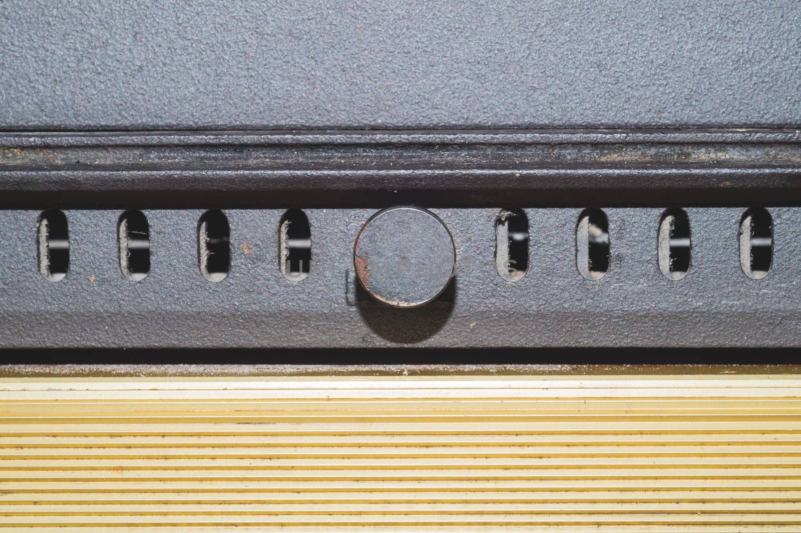 Detail of an old stove. ash pit of furnace close up