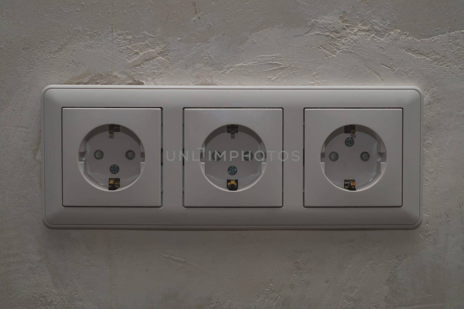 Power socket in the wall. electrical outlet close up. process of renovation