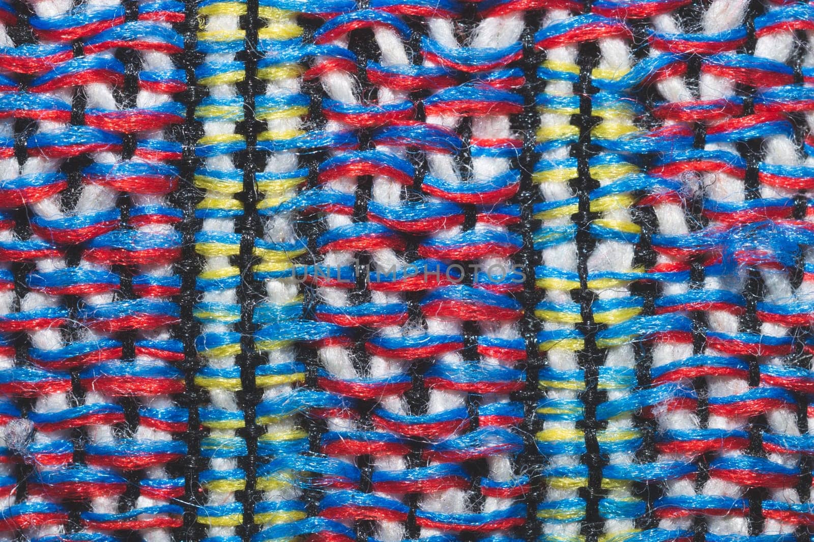 Colorful knitted wool background. woolen fibers close up