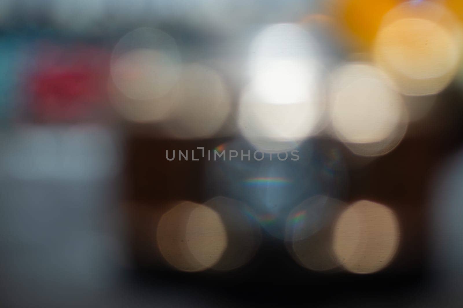 Abstract bokeh lights background. blurred circles shines in the dark