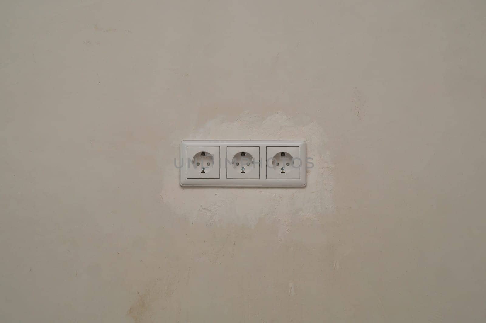 Power socket in the wall. electrical outlet close up. process of renovation