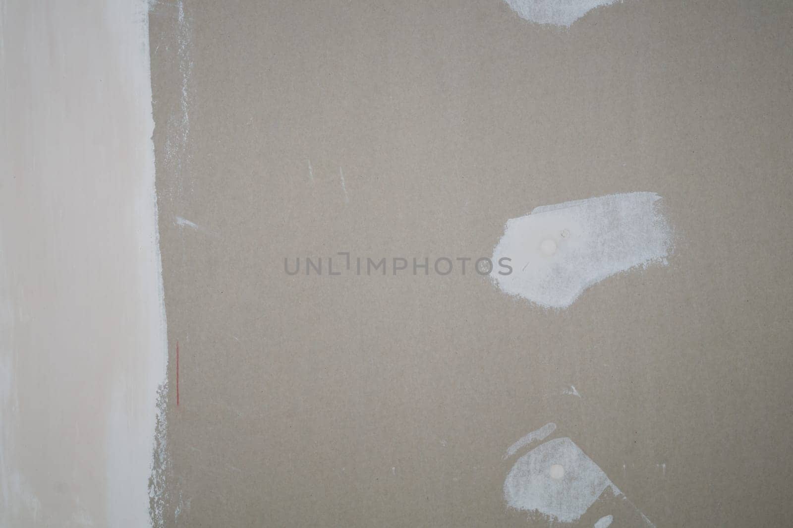 Plasterboard wall putty stains. prepared wall for renovation
