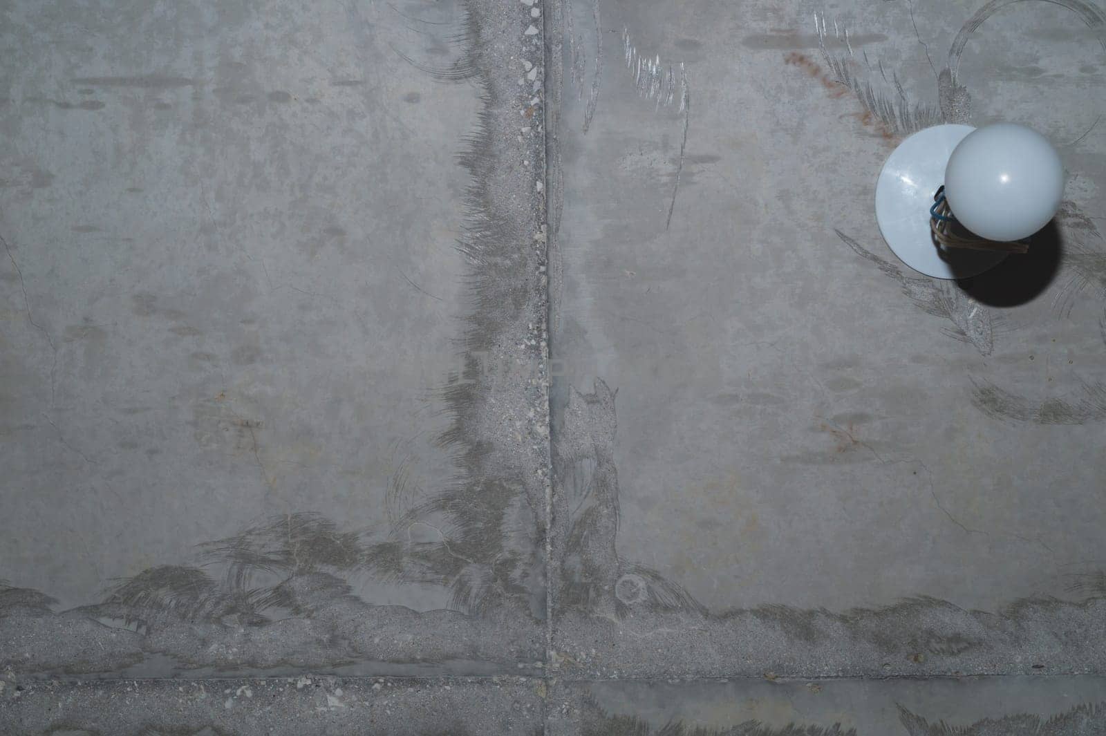 Concrete wall with cracks and scratches. abstract gray background with patterns. wall is ready for renovation works