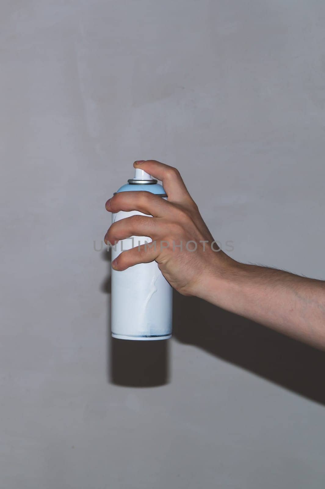 Spray can in hand. painting process