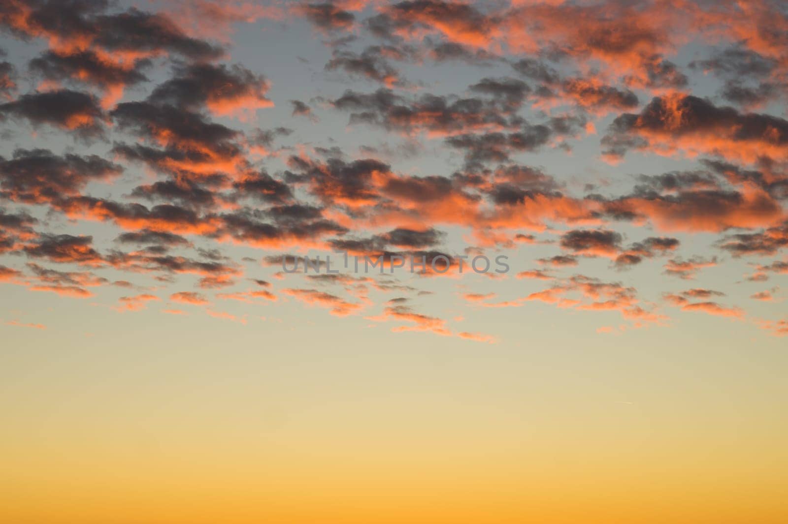 Golden sunset cloudscape. sky with clouds at the evening