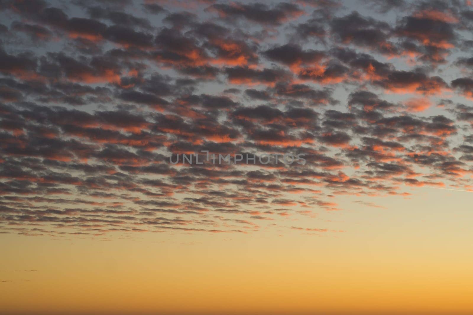 Golden sunset cloudscape. sky with clouds at the evening