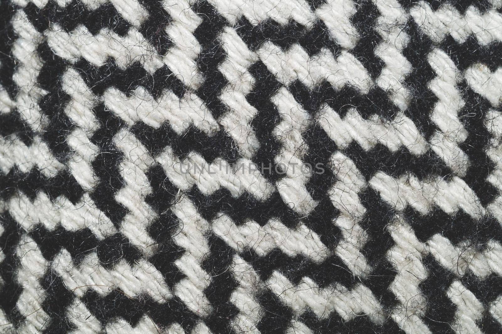 Wool carpet texture close up. knitted rug background