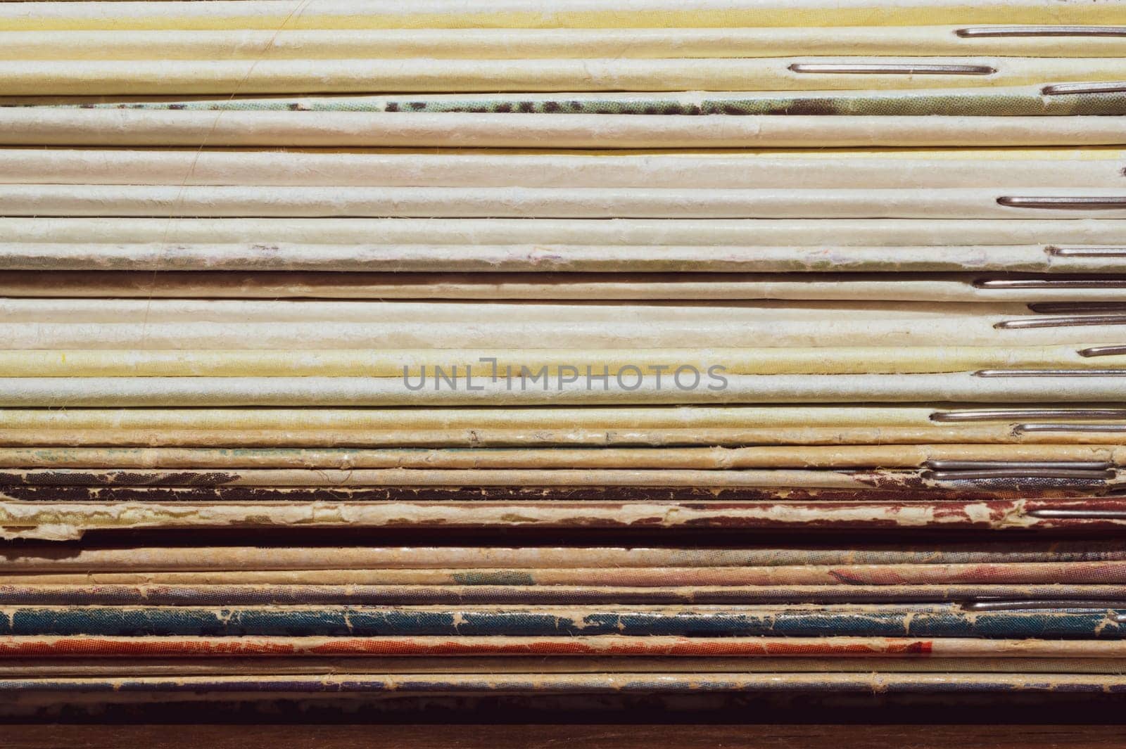 Stack of old magazines. pile of retro newspapers. vintage journals lie on top of each other
