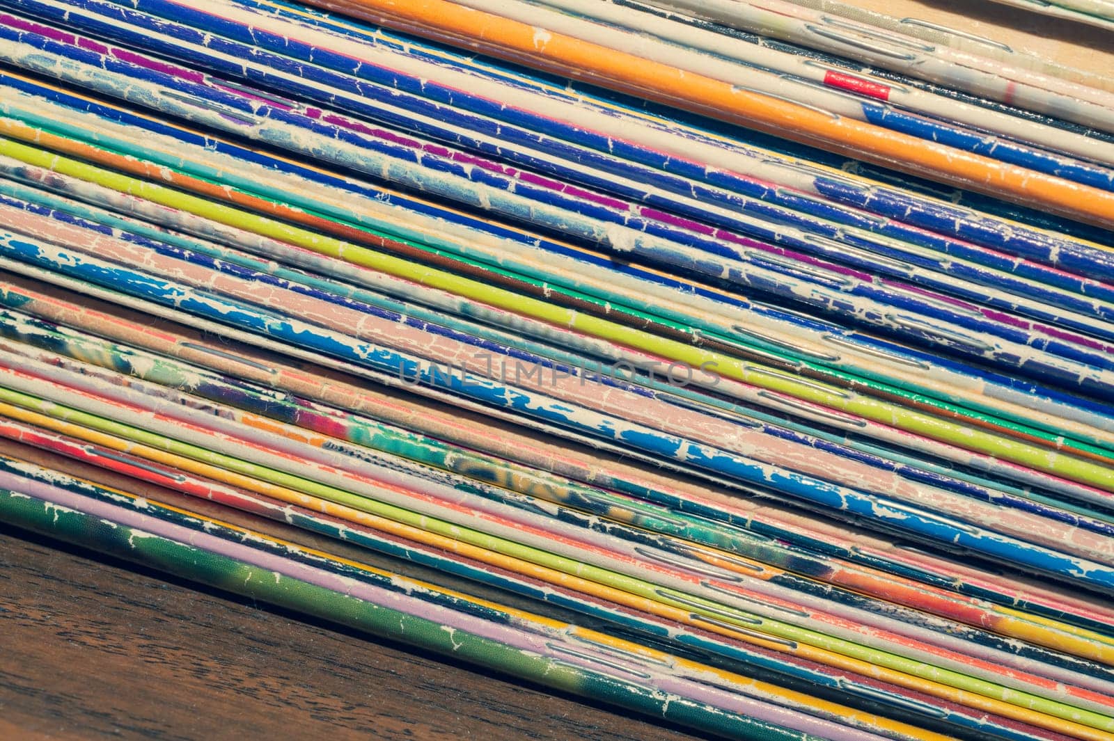 Stack of old magazines. pile of retro newspapers. vintage journals lie on top of each other. colorful background from the printed publications