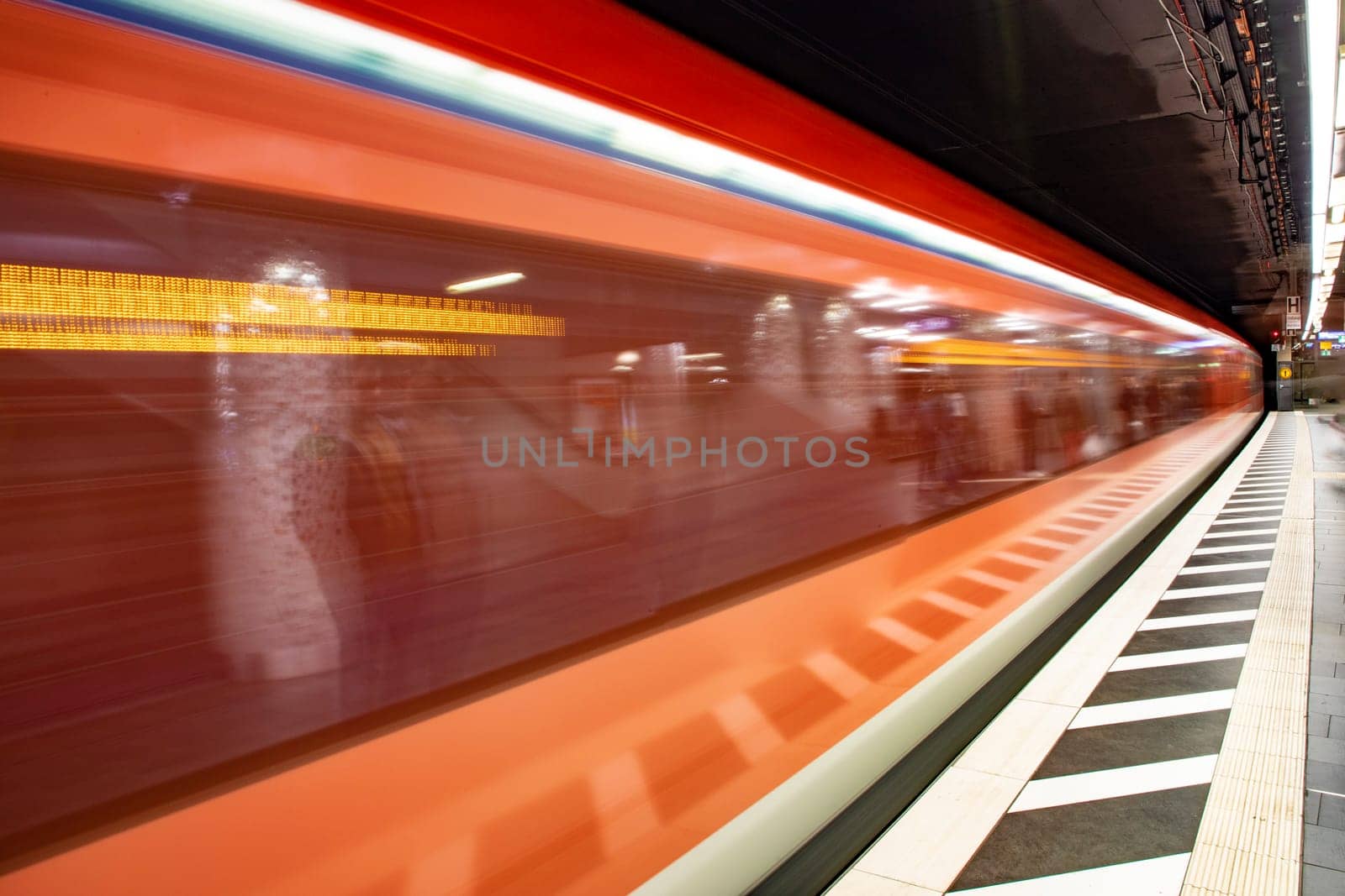 blurred motion of metro train entering the train station in Frankfurt