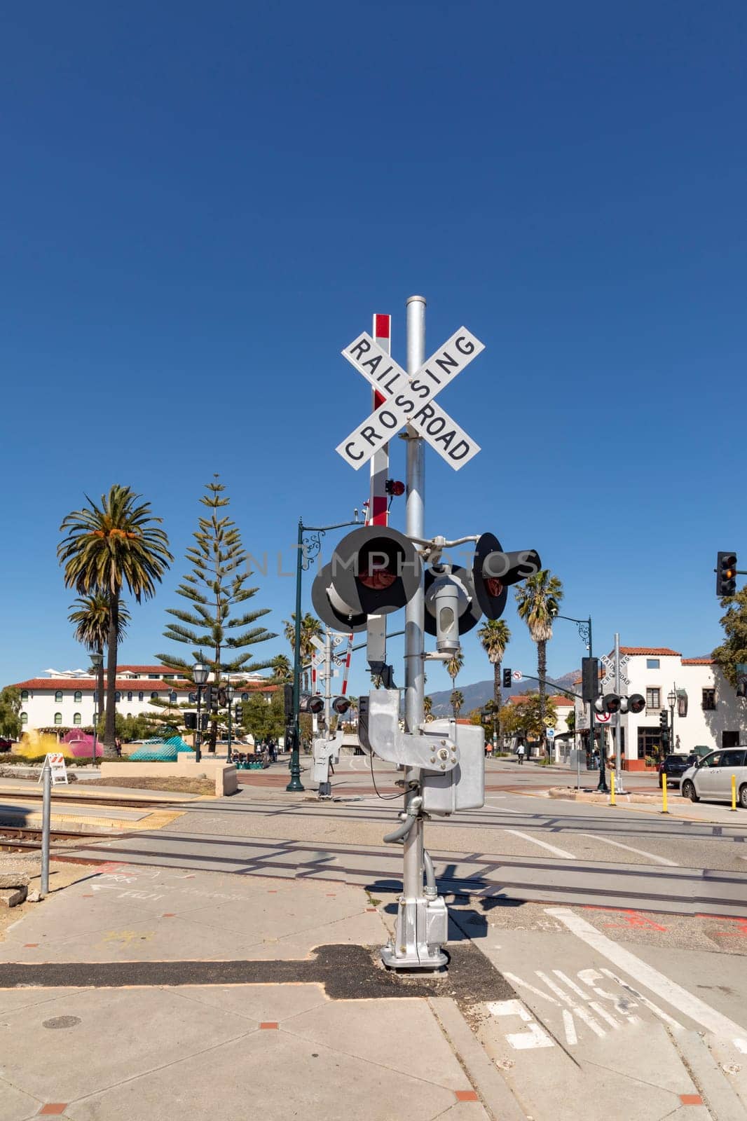 railroad crossing sign under clear blue sky
