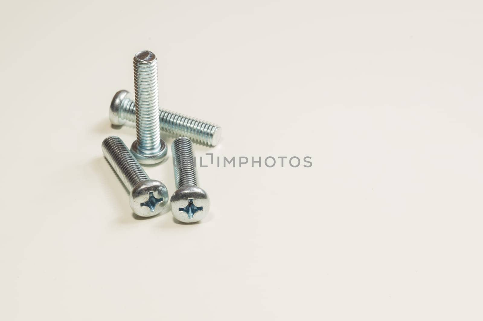 Steel screw on a white background. working tools