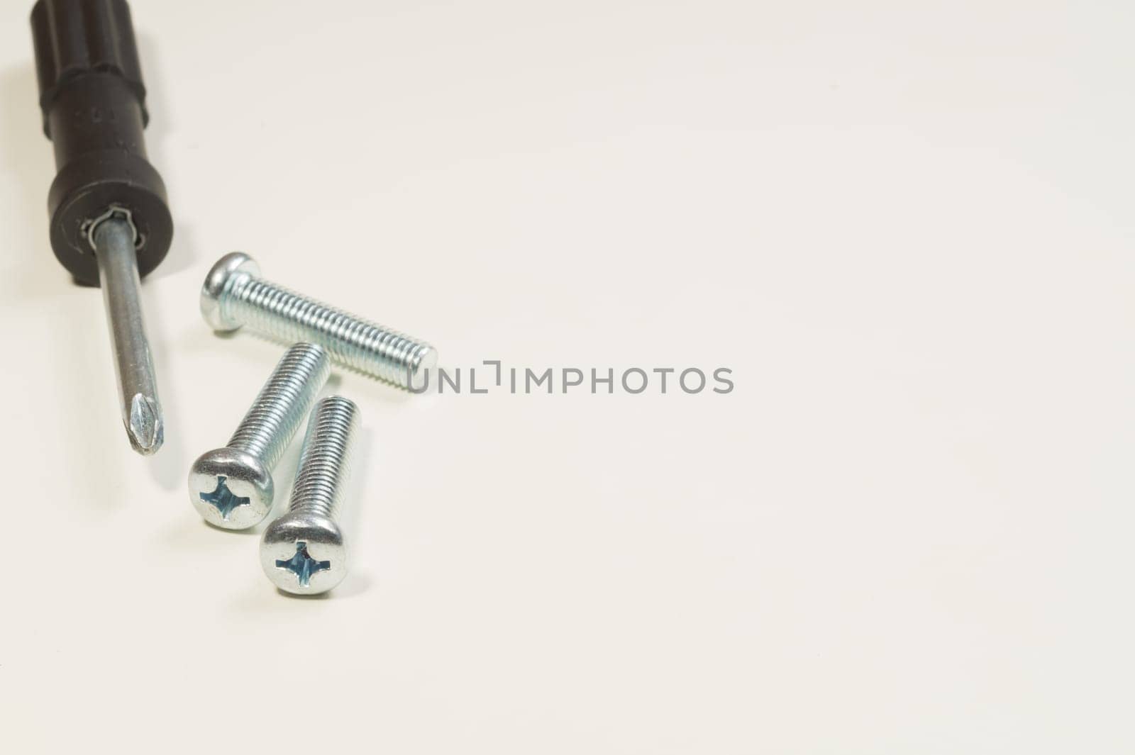Steel screw on a white background. working tools