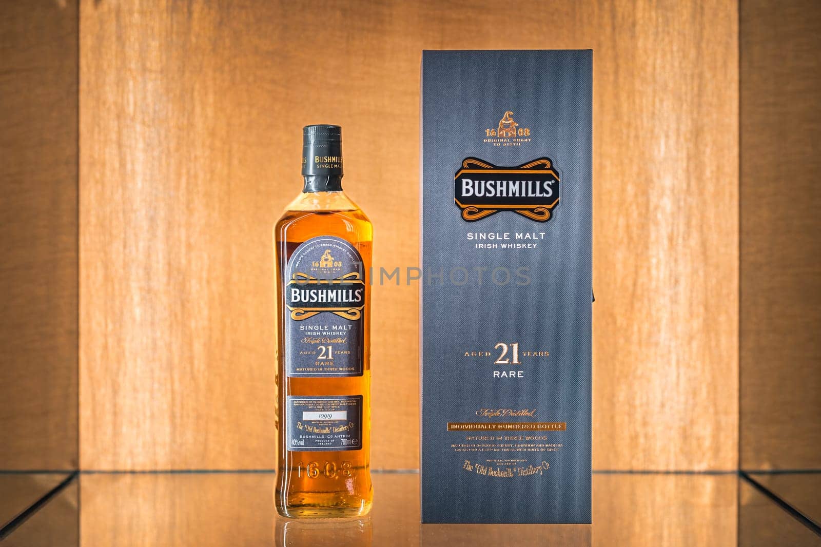 Bushmills, Northern Ireland, Aug 2019 Selective focus on rare, aged 21 years Bushmills whiskey with a box on illuminated display in distillery shop