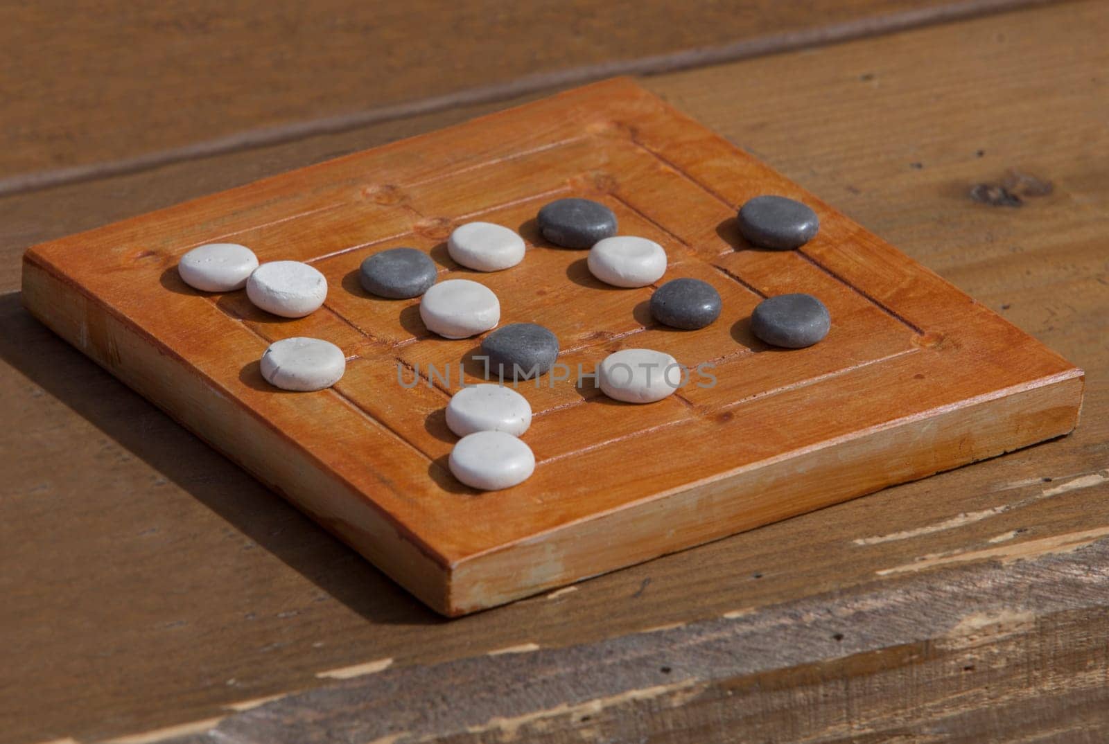 Reconstruction of roman board game Nine mens morris or mill game. Private recreational activity of ancient romans