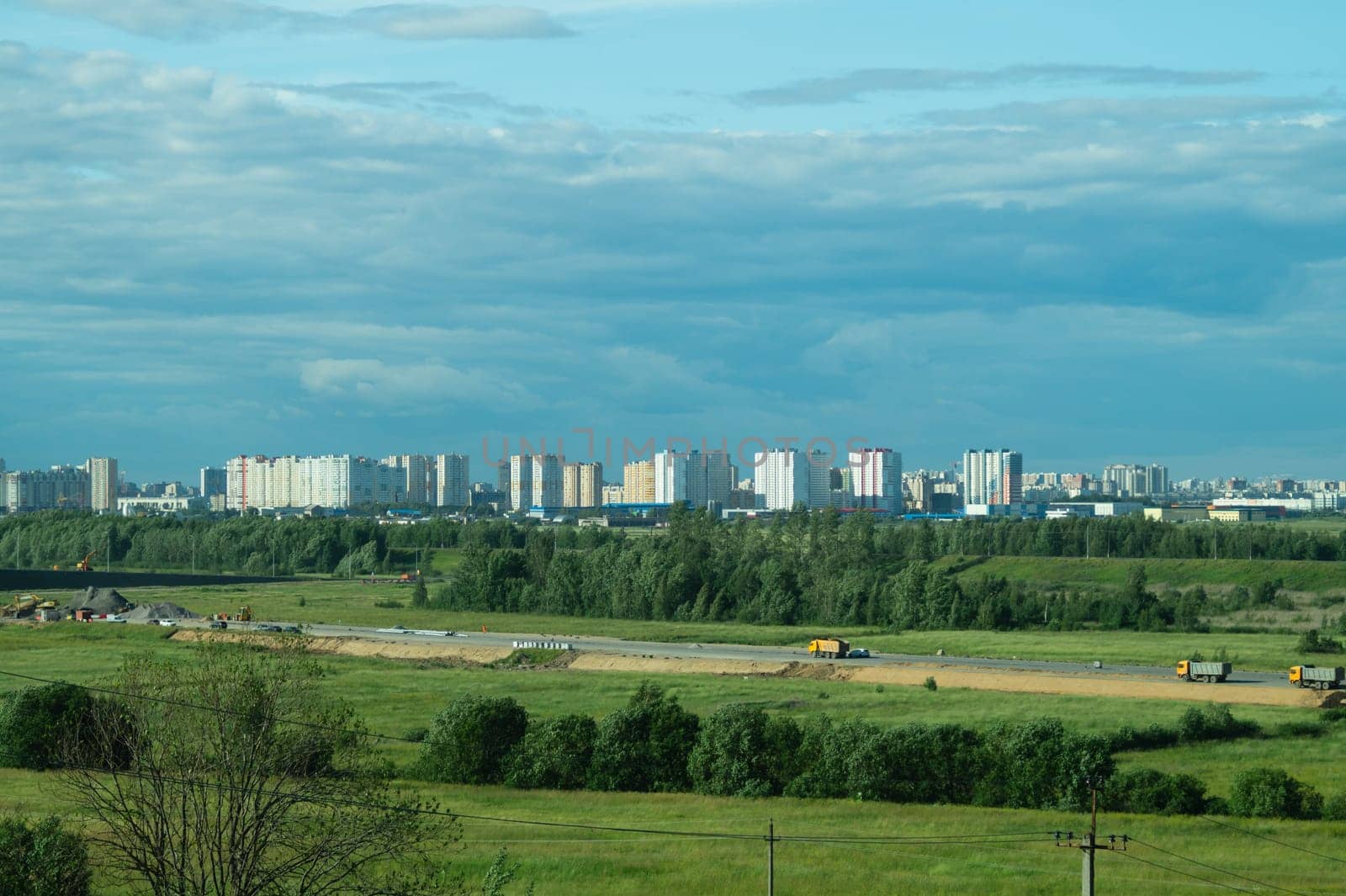 Urban cityscape panoramic view. horizon line with buildings. nature landscape with town and forest. blue sky. city into a distance