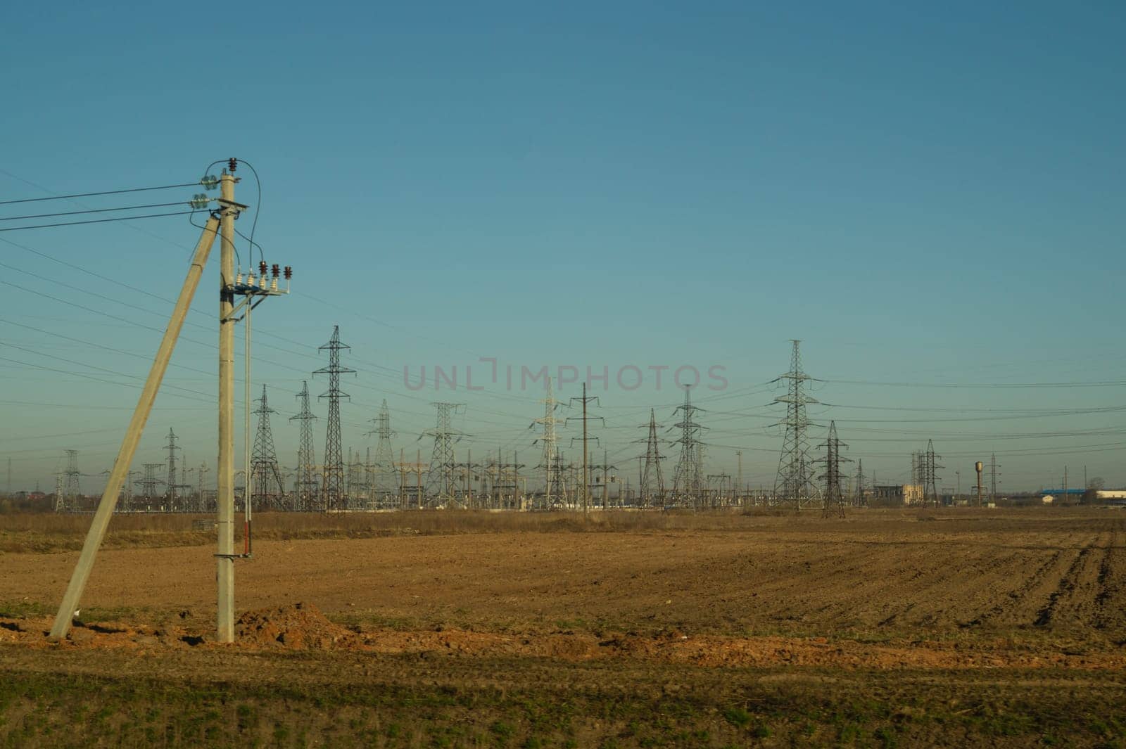 Power line posts. high voltage tower with the sky. industrial background