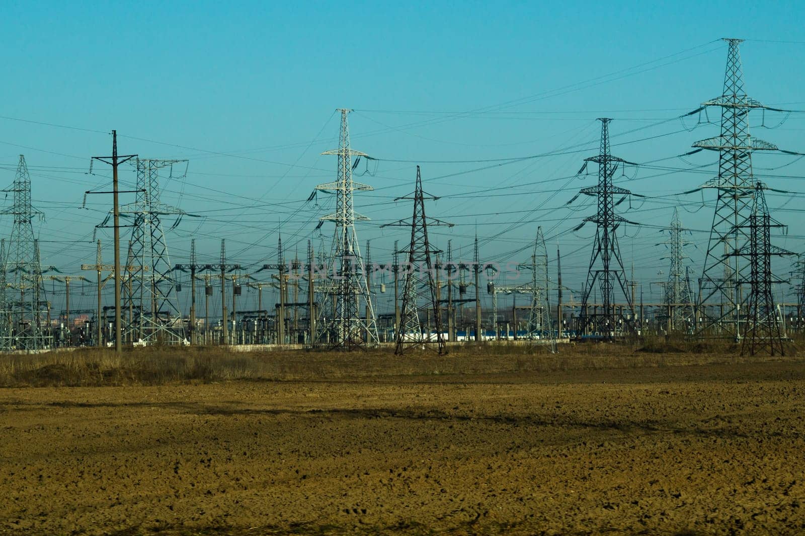 Power line posts. high voltage tower with the sky. industrial background