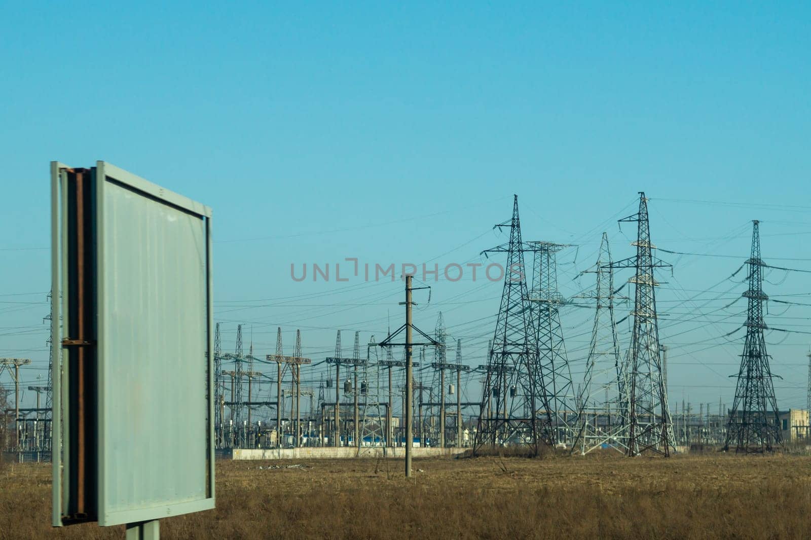 Power line posts. high voltage tower with the sky. industrial background. empty billboard. mockup