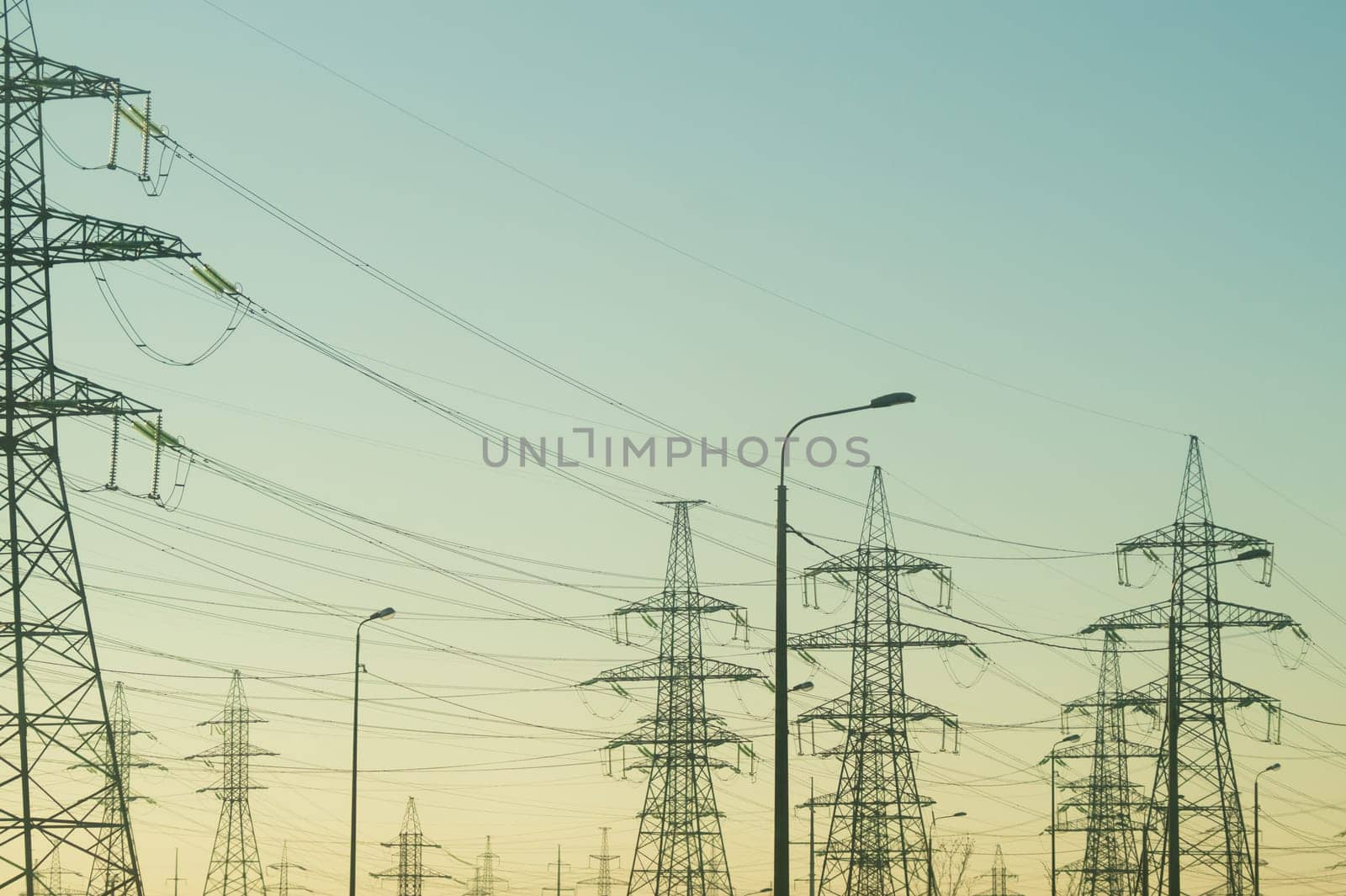 Power line posts. high voltage tower with the sky. industrial background