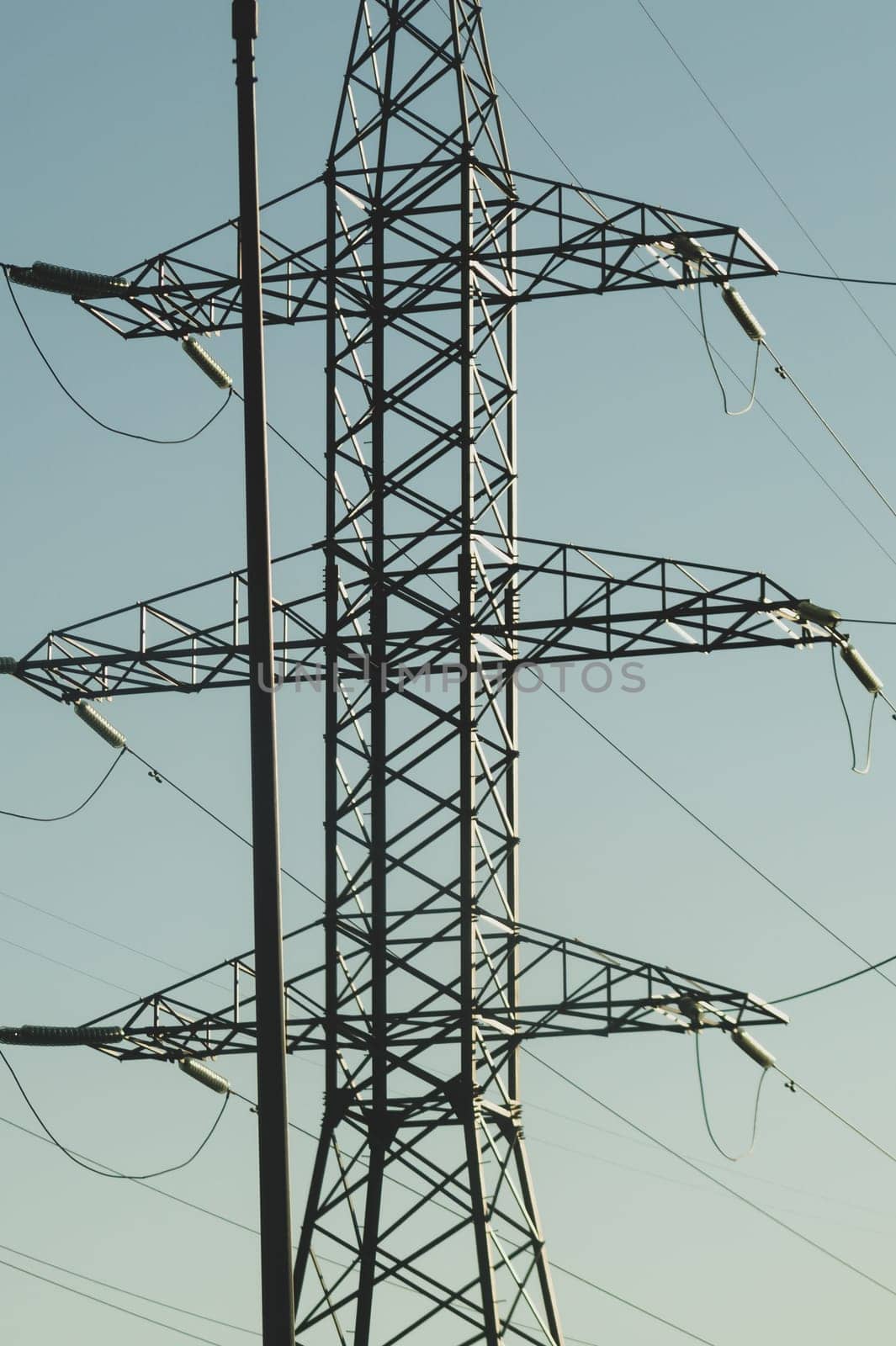 Power line post. high voltage tower with the sky. industrial background