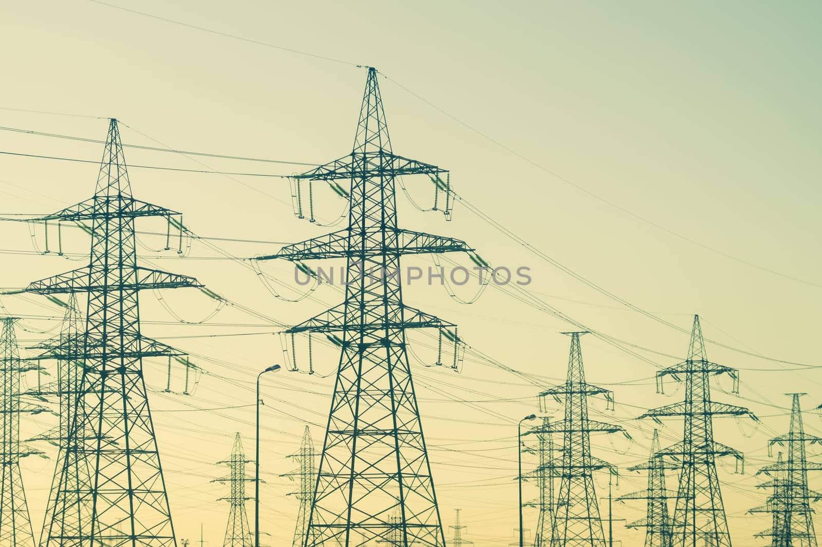 Power line posts. high voltage tower with the sky. industrial background
