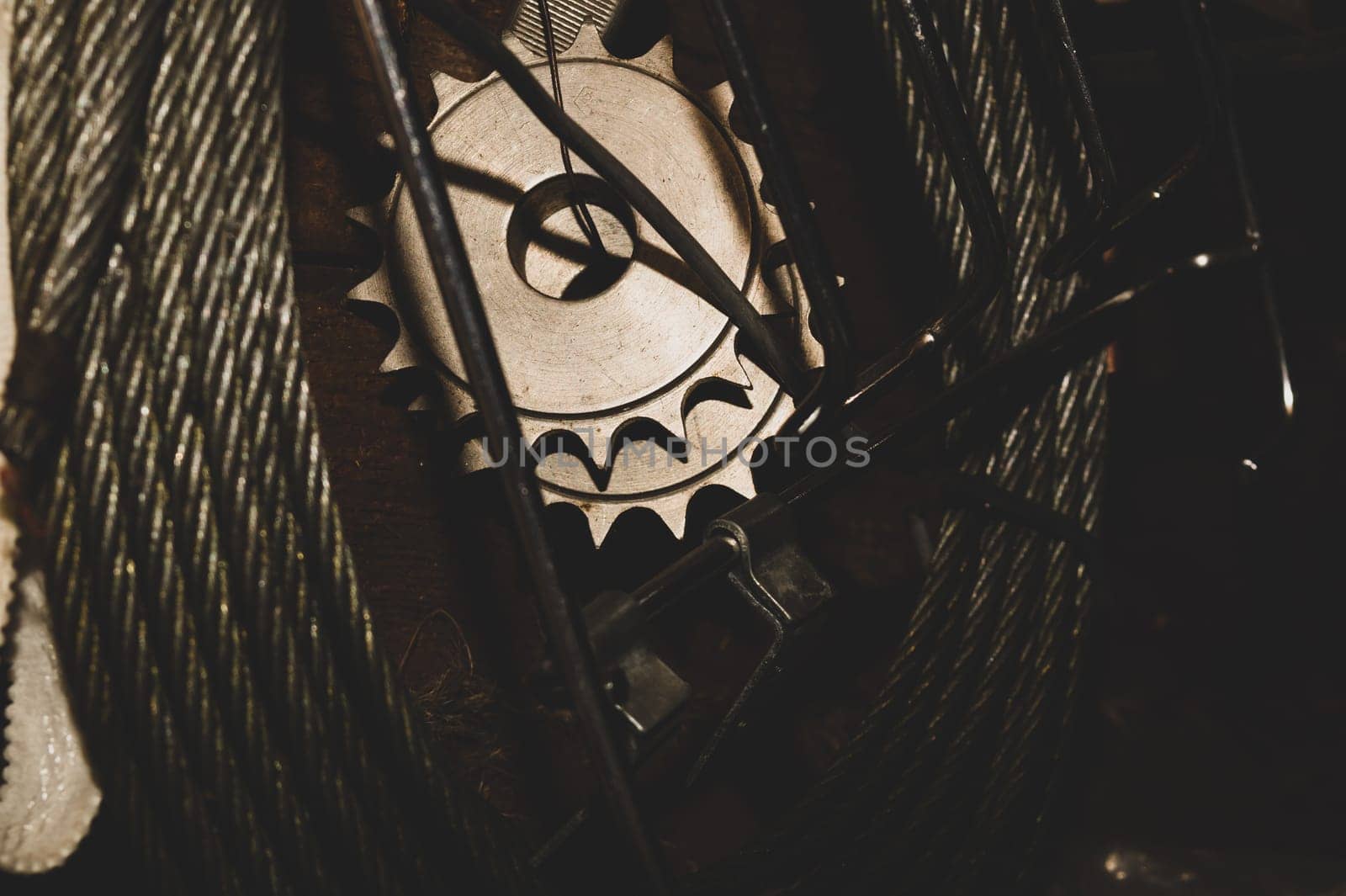 Metal circular saw hanging between wires. work tool. carpentry instrument