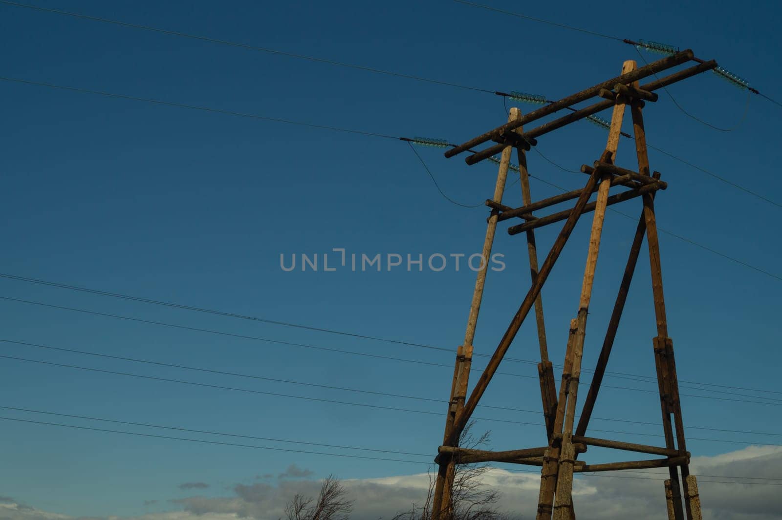 Power line post. high voltage tower with the sky. industrial background