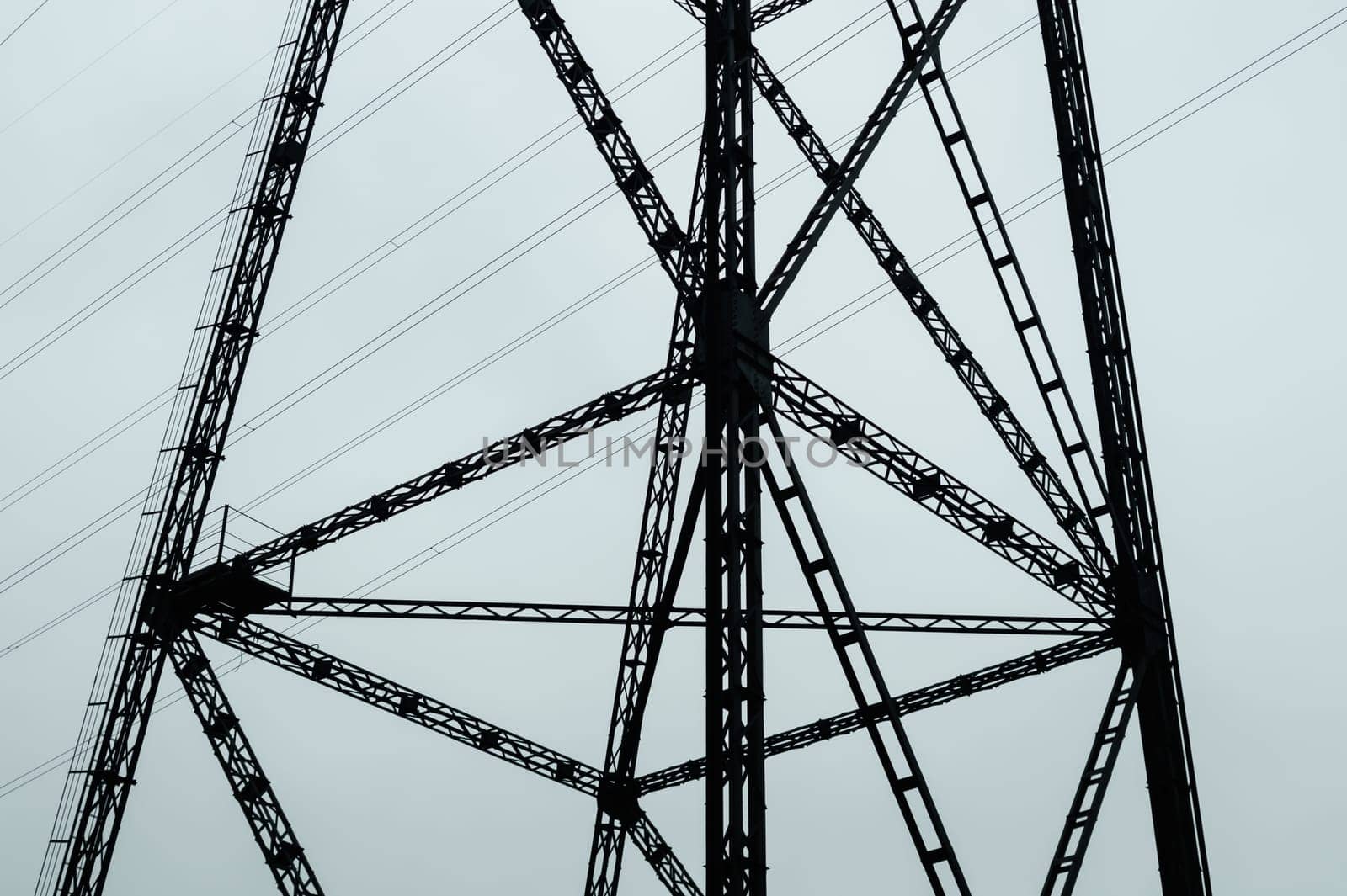 Detail of power line post. high voltage tower with the sky. industrial background
