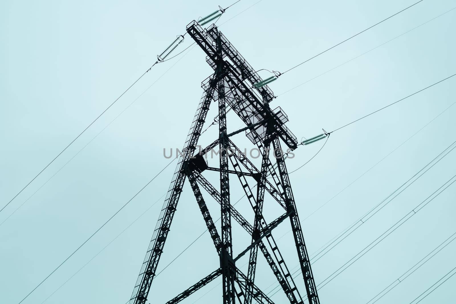 Power line posts. high voltage tower with the sky. industrial background