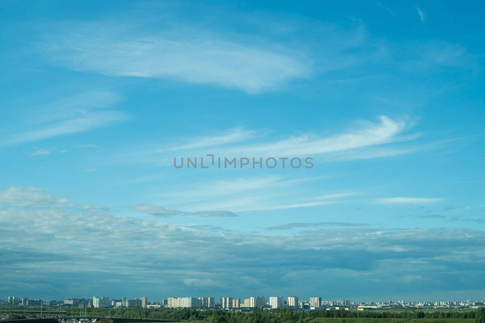 Urban cityscape panoramic view. horizon line with buildings. nature landscape with town and forest. blue sky. city into a distance