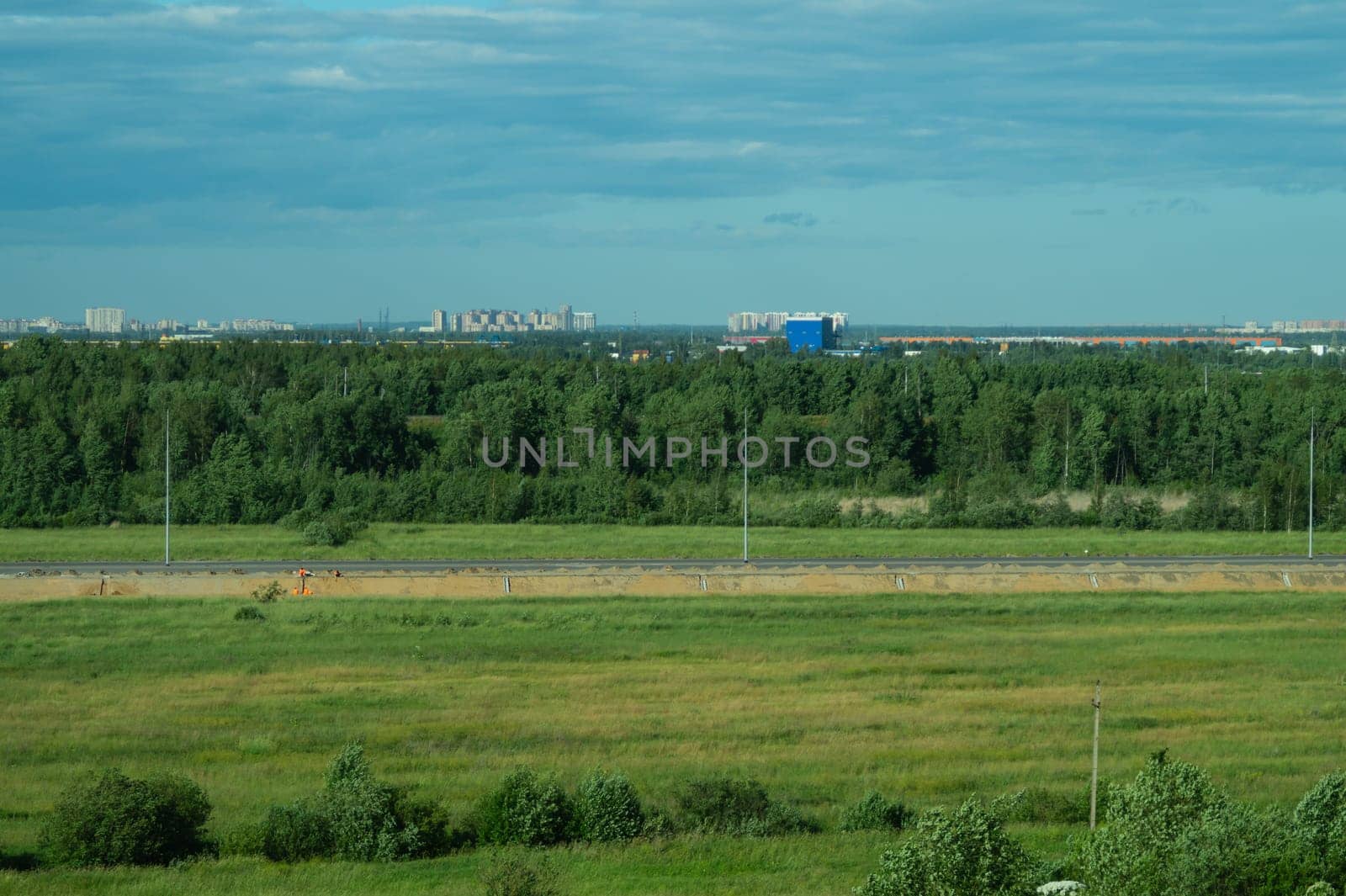 Urban cityscape panoramic view. horizon line with buildings. nature landscape with town and forest. blue sky. city into a distance