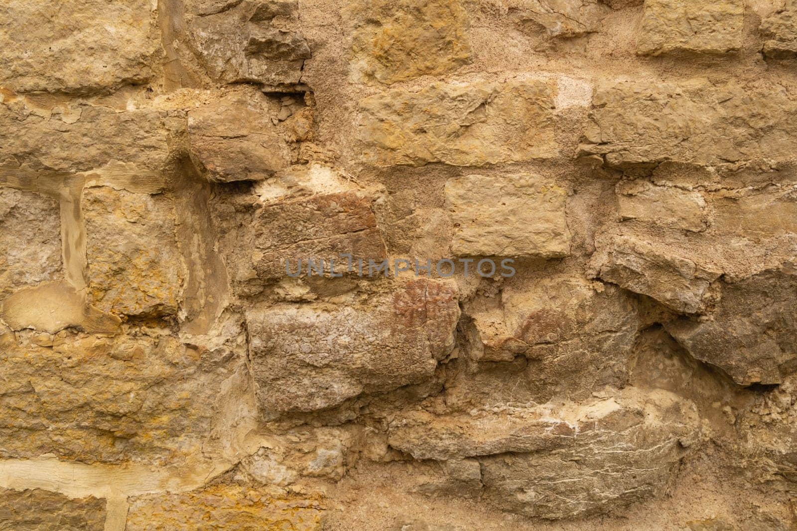 Rocky brick wall. stone wall background. abstract brown grunge texture. old masonry