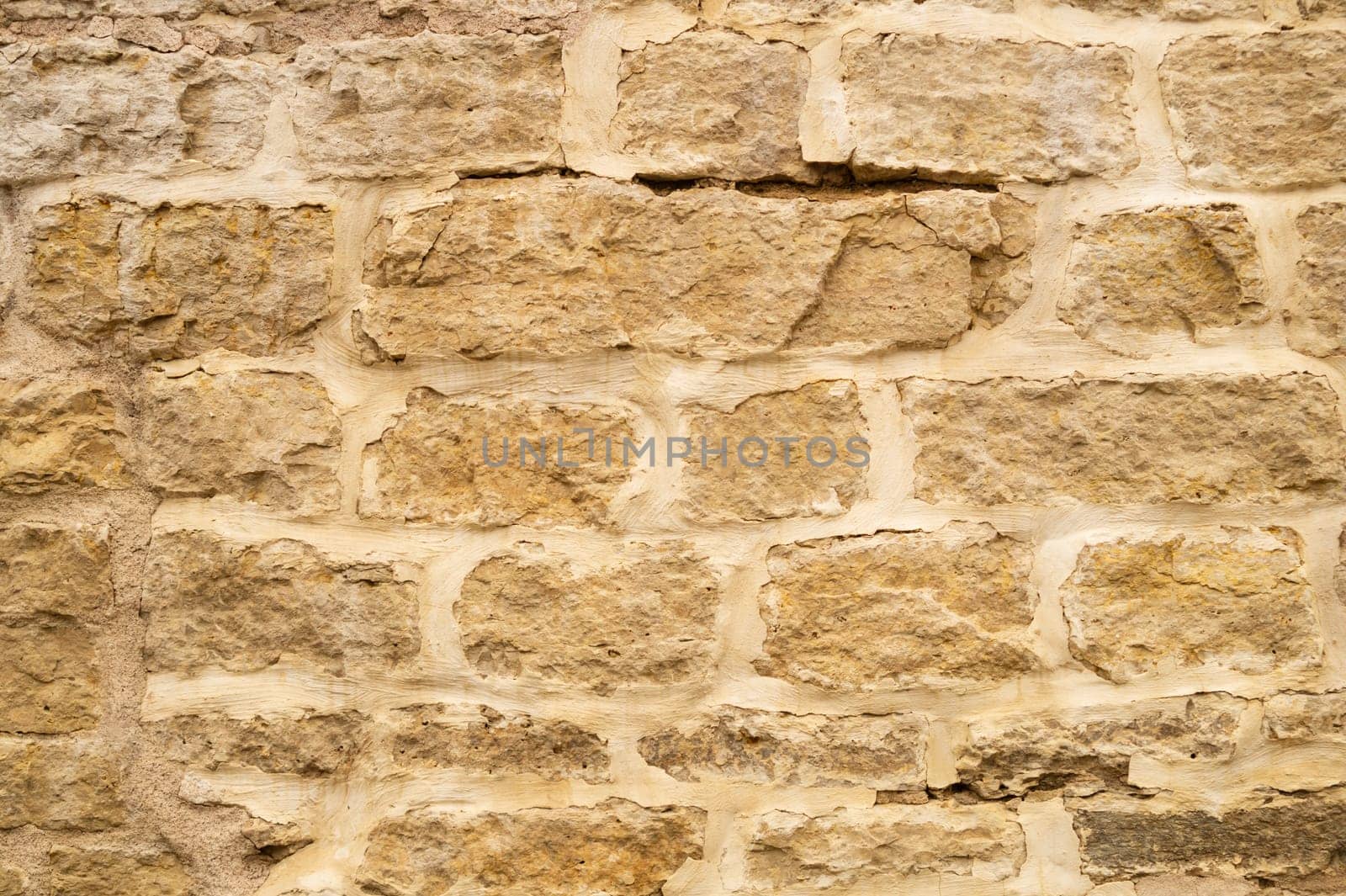 Rocky brick wall. stone wall background. abstract brown grunge texture. old masonry