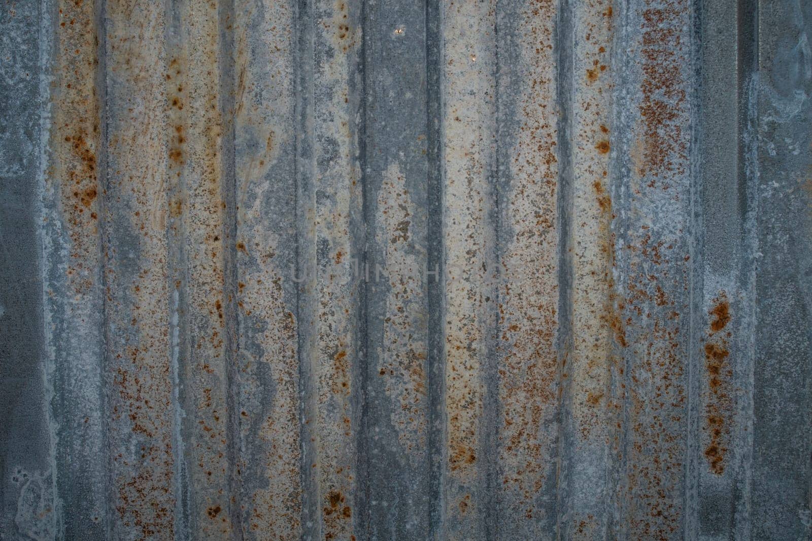 Rusty metal texture background. old iron ribbed wall