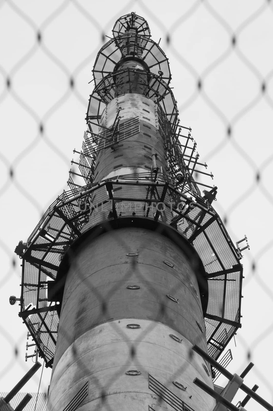 Telecommunication tower. high radio antenna. big metal construction black and white