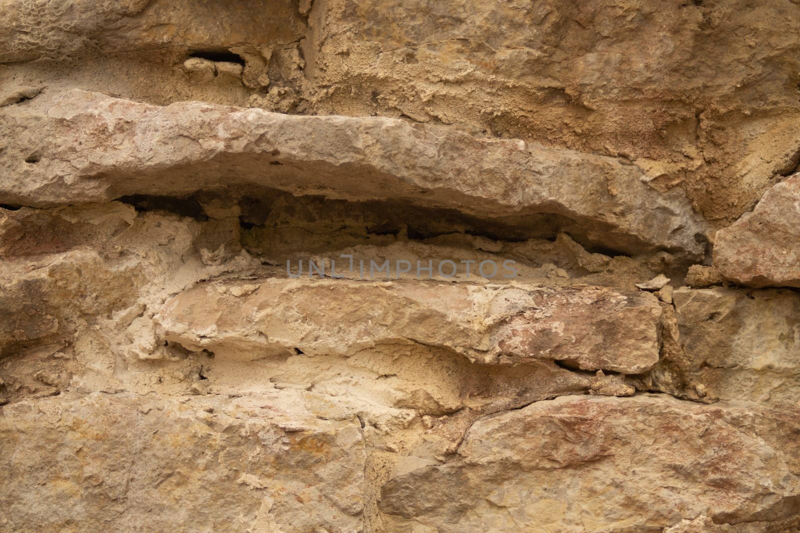 Rocky brick wall. stone wall background. abstract brown grunge texture. old masonry