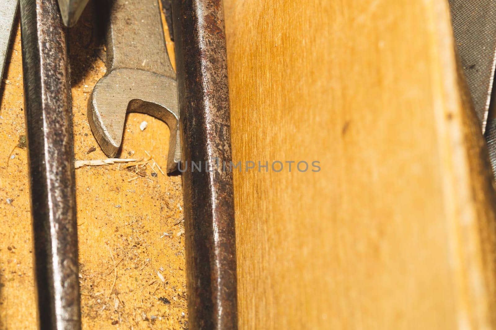 Wrench in a wooden tool box. work instrument close up