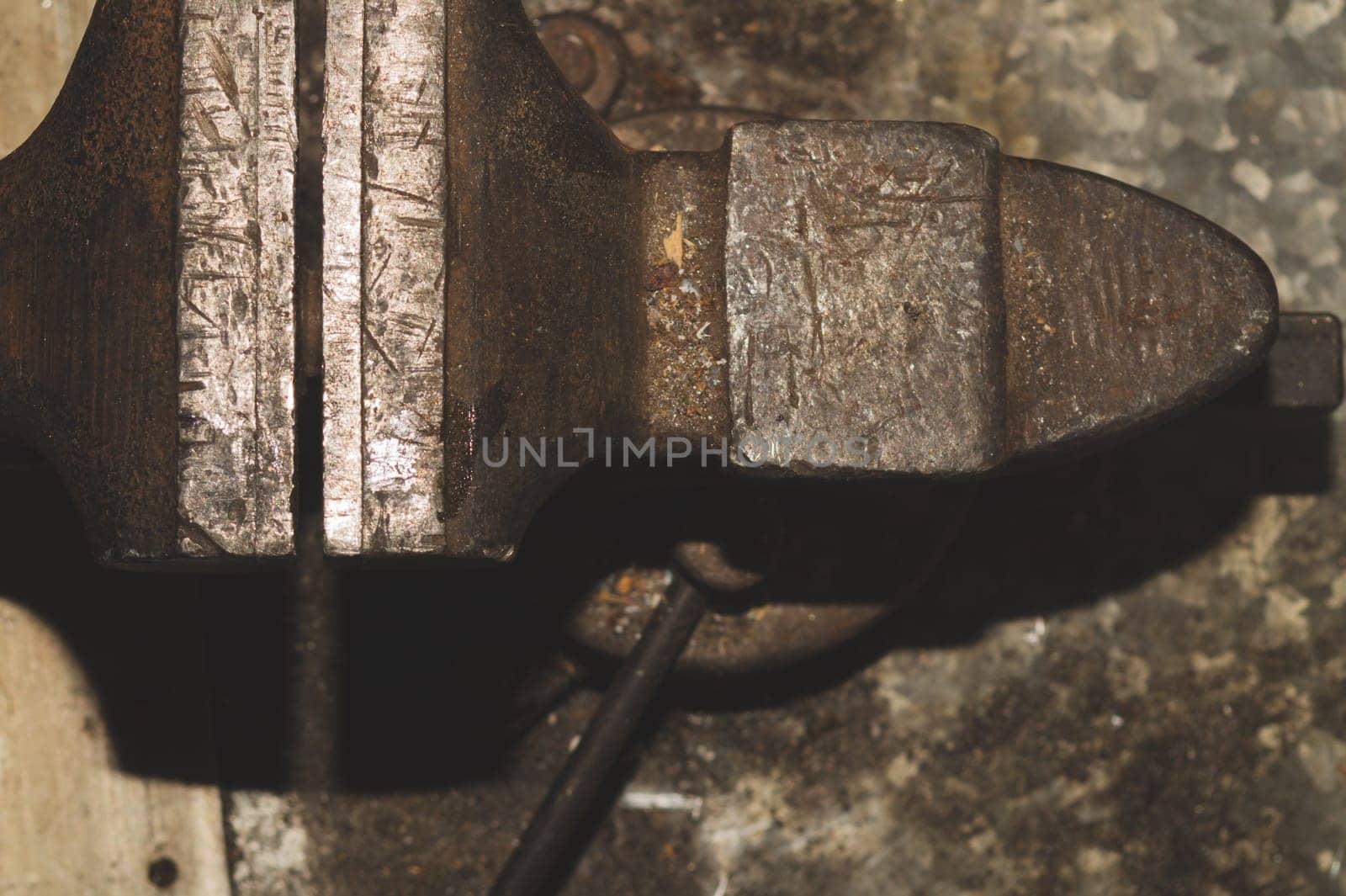 Old bench vise on a metal workbench. work tool