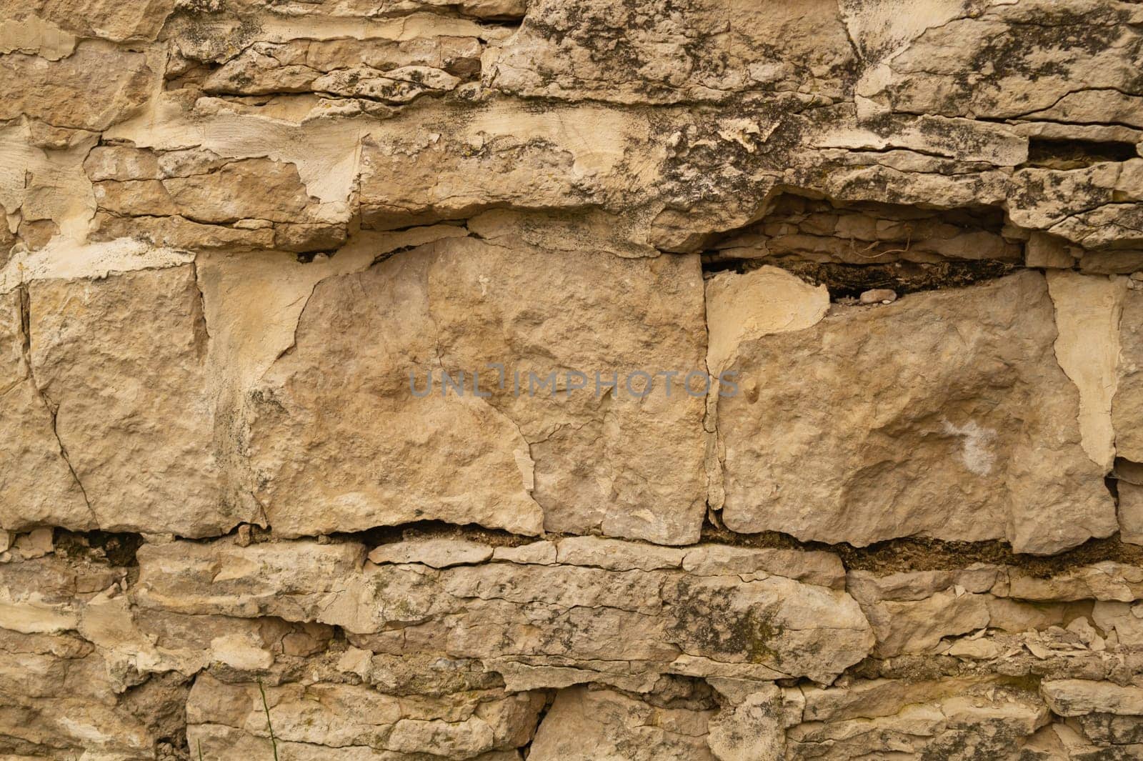 Rocky brick wall. stone wall background. abstract brown grunge texture. old masonry