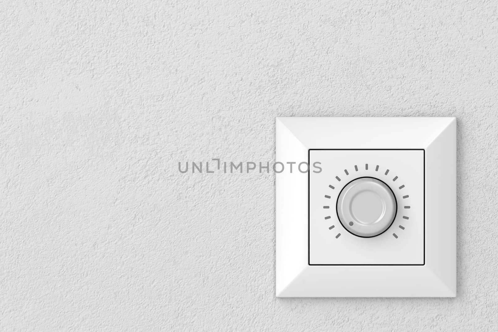 Dimmer light switch on a wall