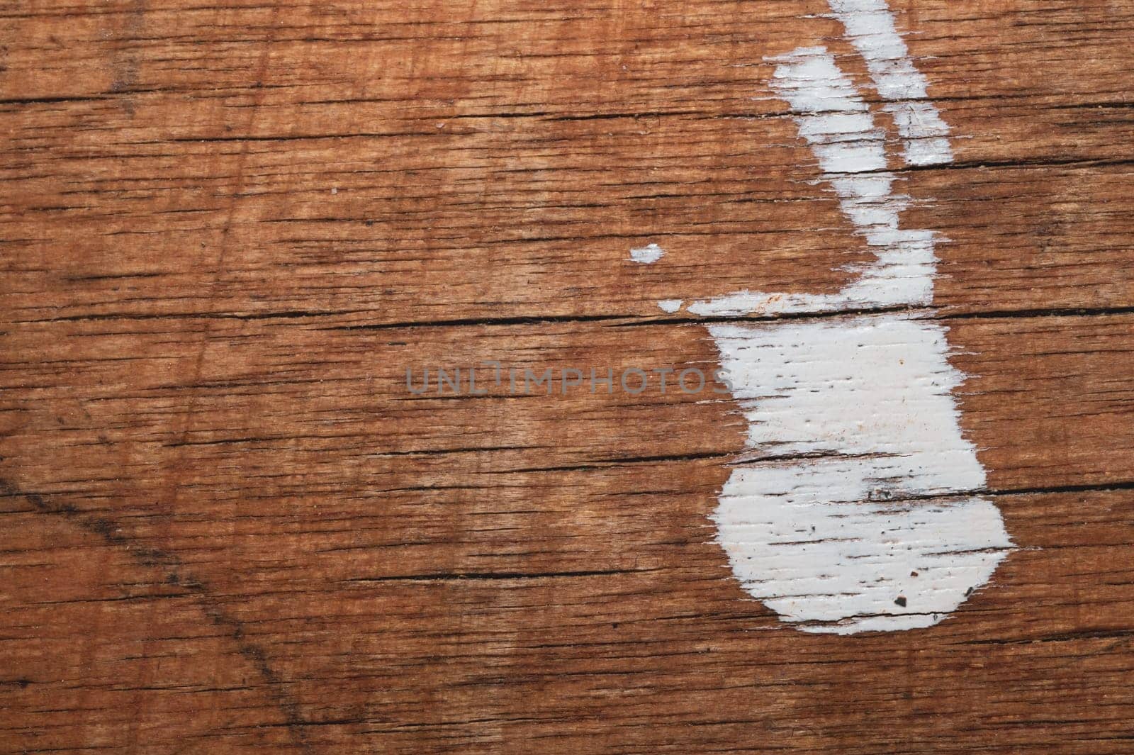 Rough wood with white paint spots. old wooden texture. scratched and cracked surface