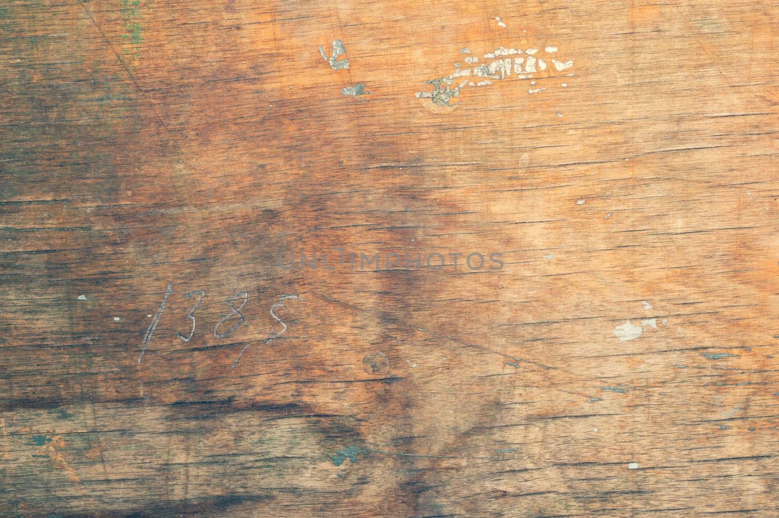Wood surface with drawn number. old wooden texture. cracked and scratched background